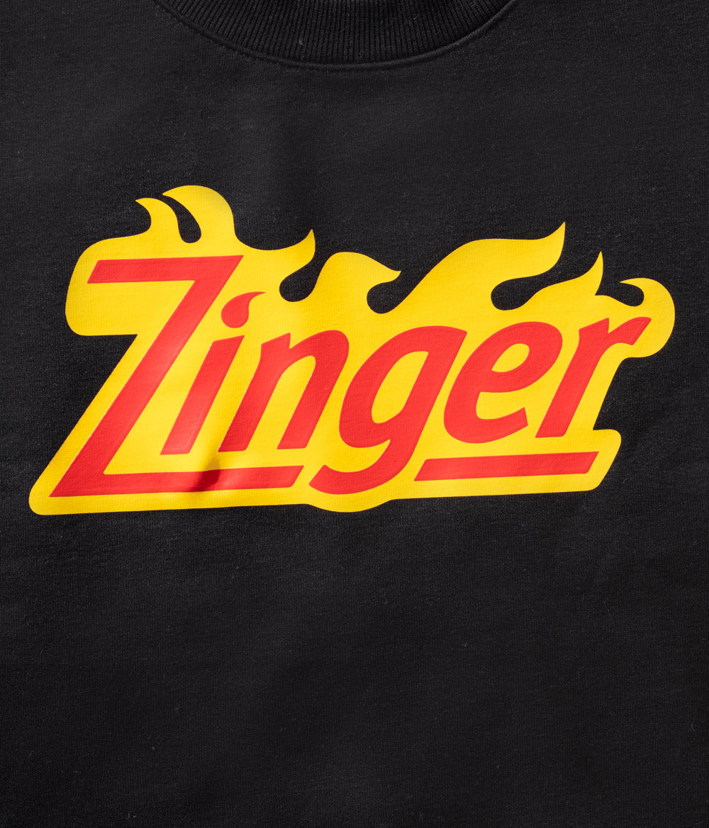 close up view of 'Zinger' branded logo on black material
