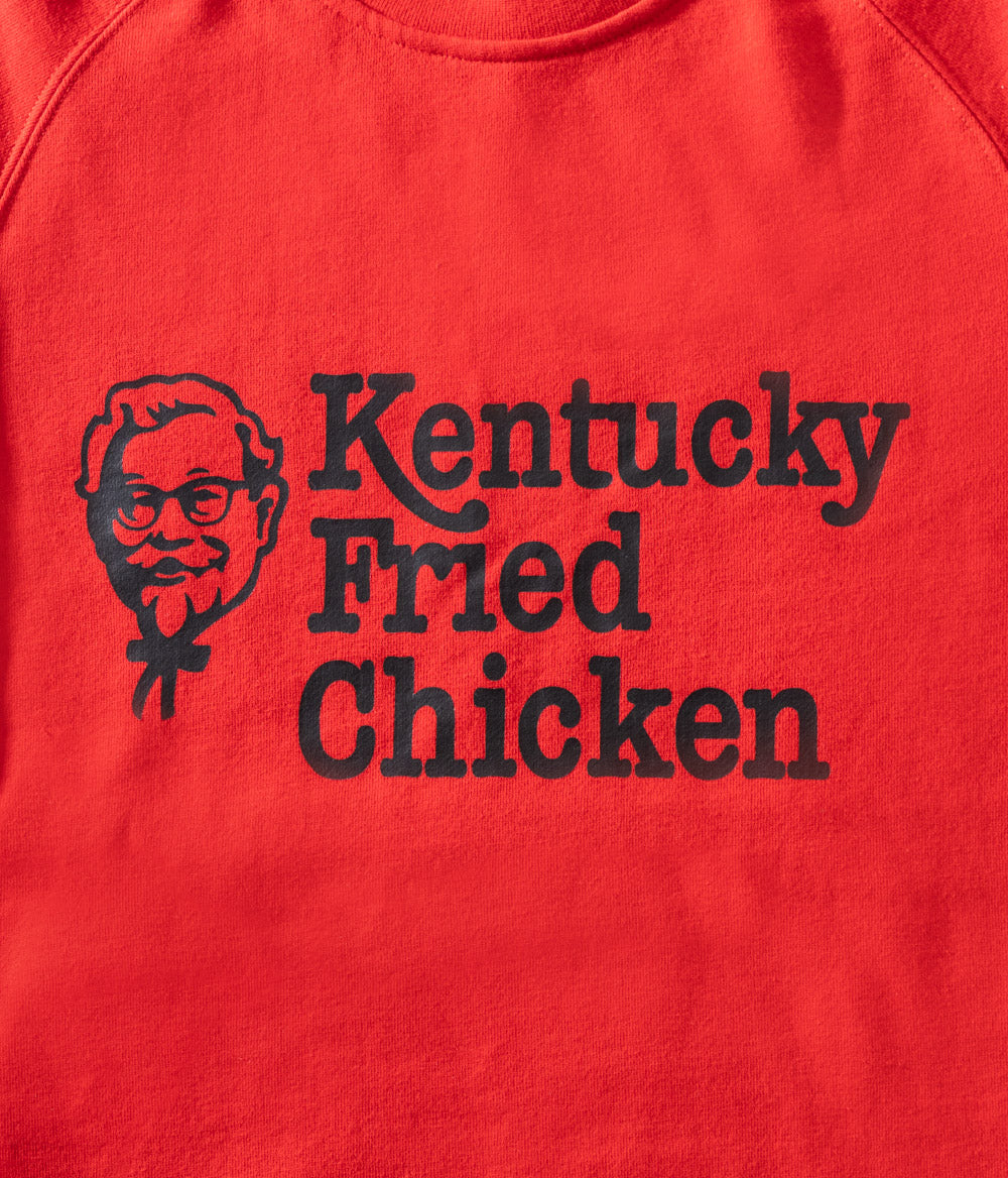close up view of 'Kentucky Fried Chicken' message on red jumper