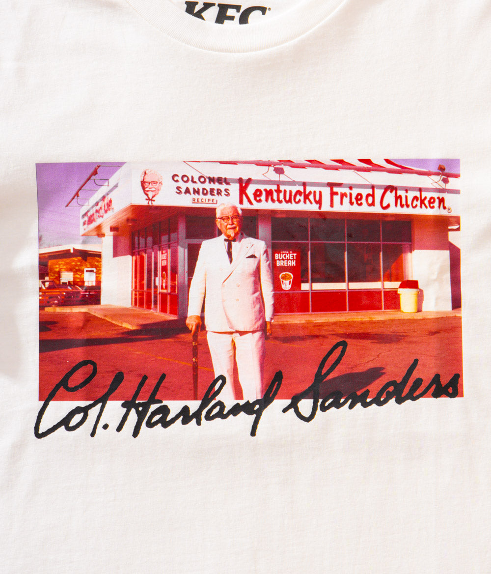 close up view of KFC white tee short with image of colonel sanders