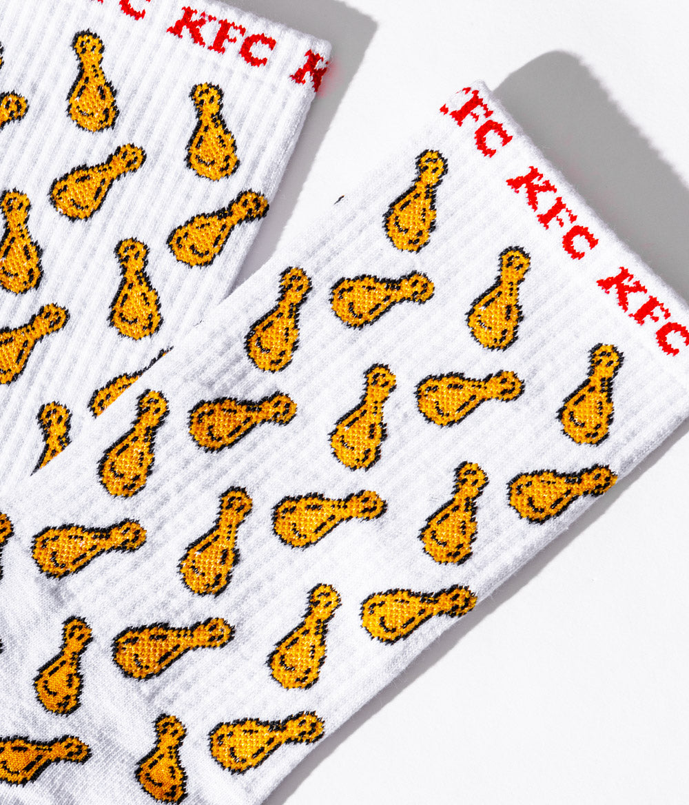 close up of KFC white socks branded with repeating fried chicken drumsticks