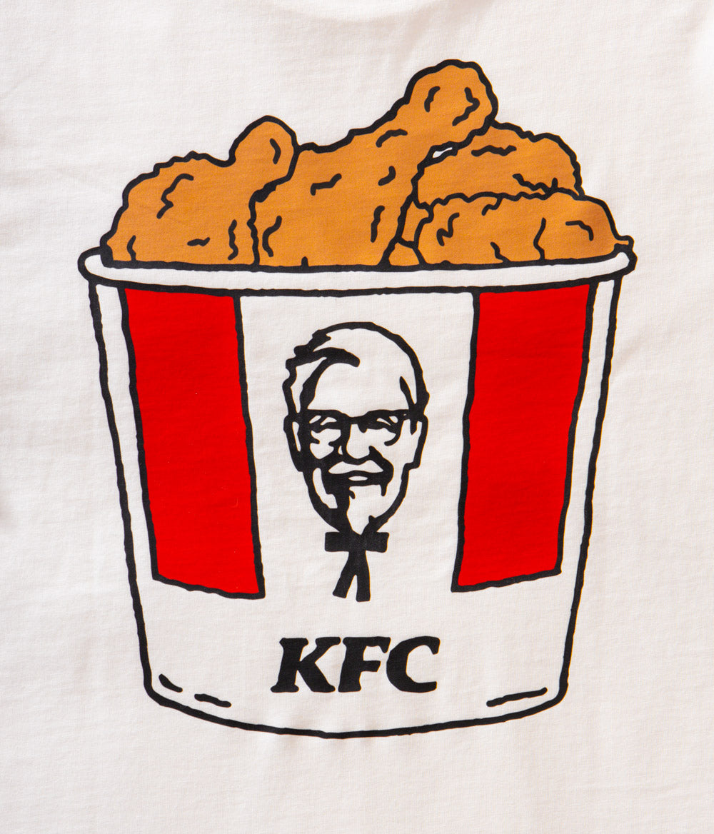 close up view of white branded KFC tee shirt with KFC bucket logo and chicken