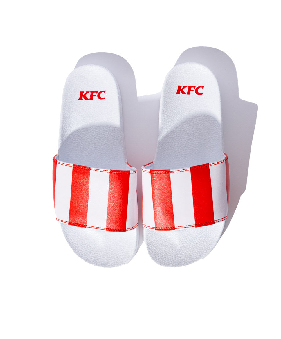 KFC white slides with red and white KFC striped branding
