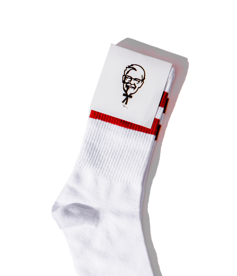 Close up view of KFC white socks with red stripes and colonel sanders logo