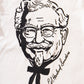 close up view of white KFC tee shirt with black branded portrait of Colonel Sanders