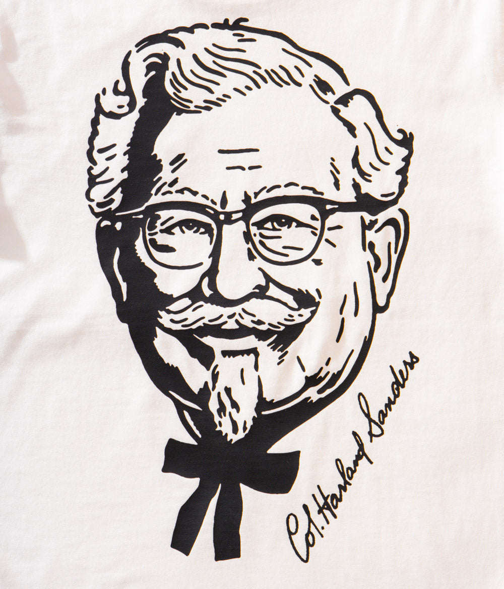 close up view of white KFC tee shirt with black branded portrait of Colonel Sanders