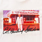 close up view of KFC white tee short with image of colonel sanders