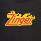 close up view of KFC black tee shirt with 'Zinger' branding 