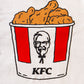 close up view of white branded KFC tee shirt with KFC bucket logo and chicken