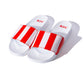 white slides with KFC red and white striped branding 
