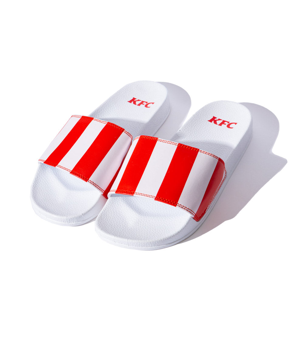 white slides with KFC red and white striped branding 