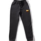 black track pants with KFC Zinger logo
